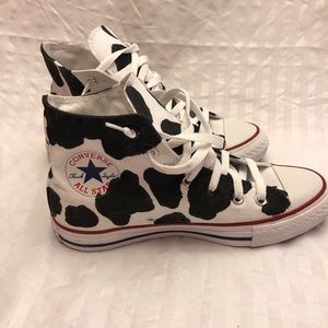 cow print high top converse